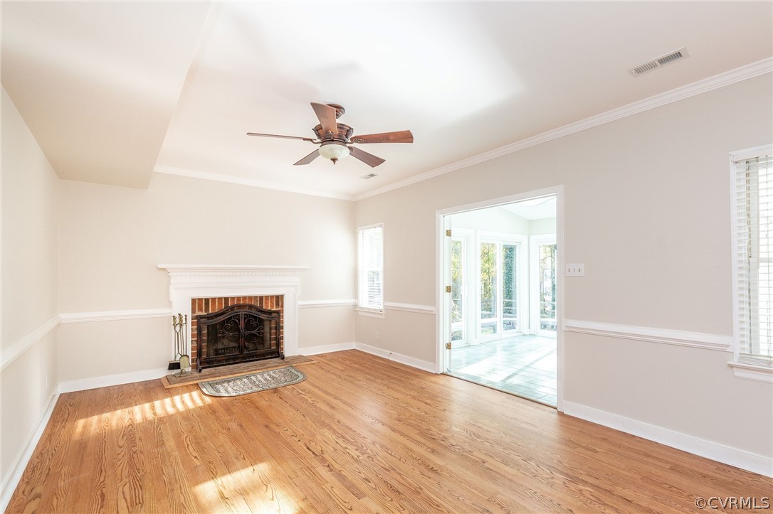 14301 Huntgate Woods Road Midlothian, VA 23112 - Photo 13 of 34 a view of empty room with wooden floor and fireplace