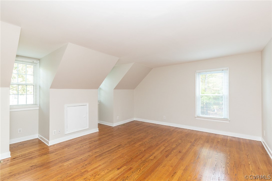 14301 Huntgate Woods Road Midlothian, VA 23112 - Photo 20 of 34 an empty room with wooden floor and windows