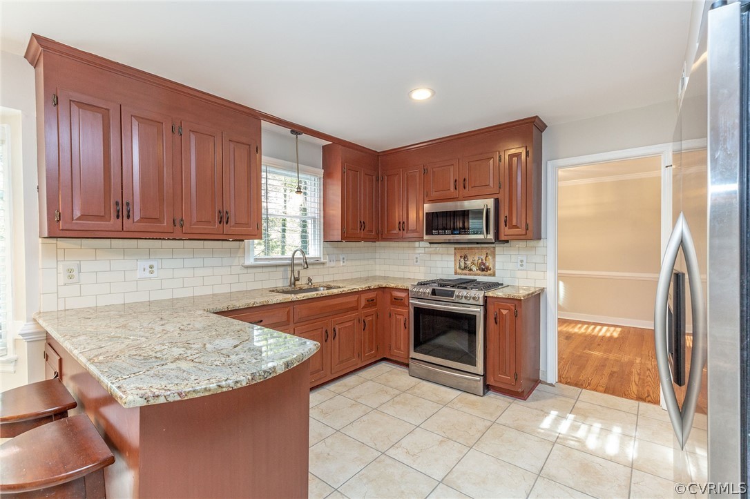 14301 Huntgate Woods Road Midlothian, VA 23112 - Photo 2 of 34 a kitchen with stainless steel appliances granite countertop a sink stove and refrigerator