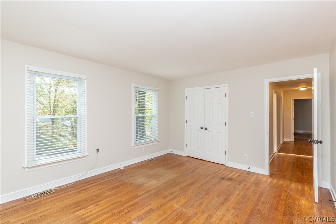 14301 Huntgate Woods Road Midlothian, VA 23112 - Photo 23 of 34 a view of empty room with wooden floor and fan