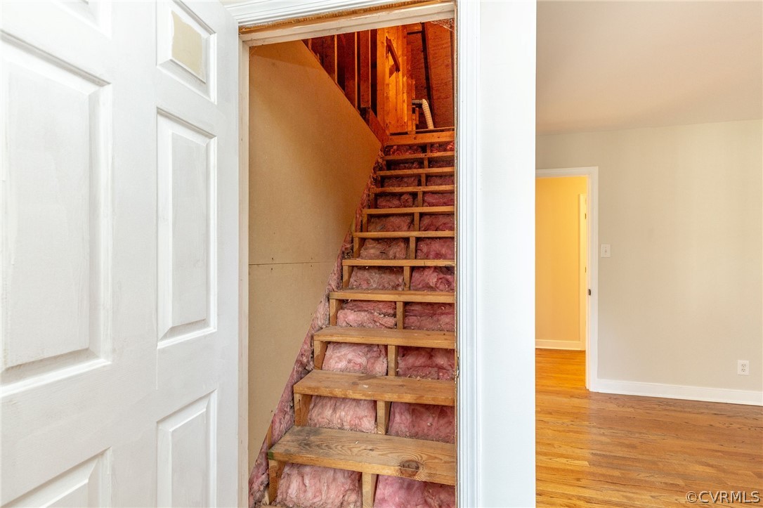14301 Huntgate Woods Road Midlothian, VA 23112 - Photo 27 of 34 a view of a living room with wooden floor and stairs