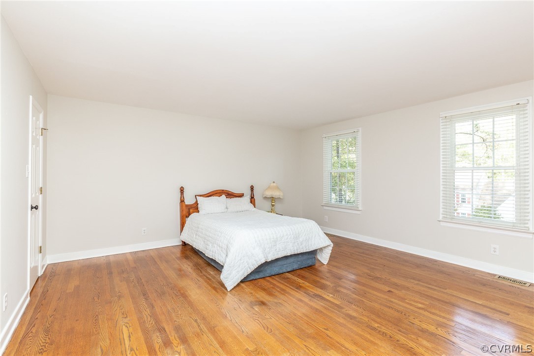 14301 Huntgate Woods Road Midlothian, VA 23112 - Photo 3 of 34 a bedroom with a bed and window