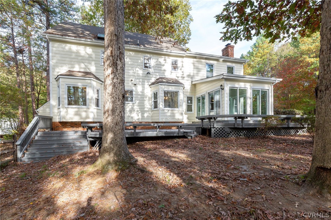 14301 Huntgate Woods Road Midlothian, VA 23112 - Photo 32 of 34 a front view of a house with a yard outdoor seating and barbeque oven
