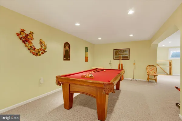 a room with furniture and pool table
