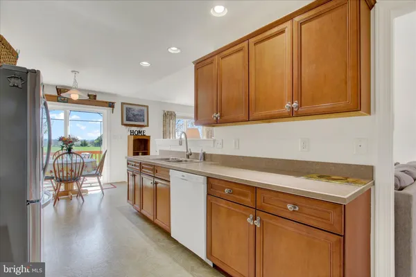 a kitchen with a refrigerator stove and a sink
