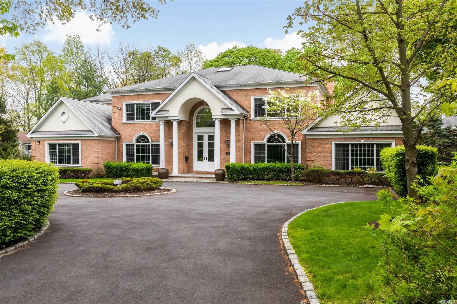 a front view of a house with yard