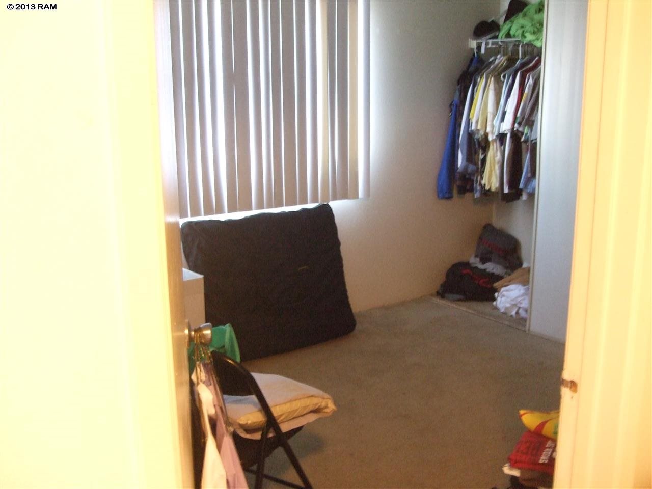 2747 South Kihei Road, Unit F106 Kihei, HI 96753 - Photo 2 of 6 a bedroom with a bed and two windows