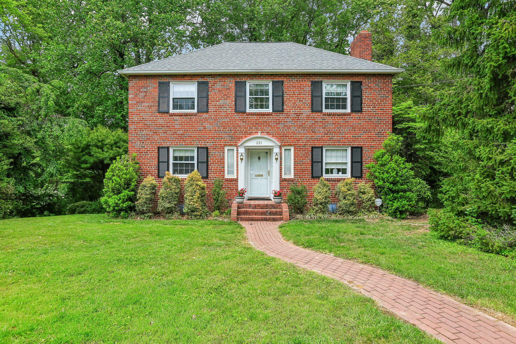 221 Patuxent Road Laurel, MD 20707 - Photo 1 of 33 Charming brick home with lush greenery.