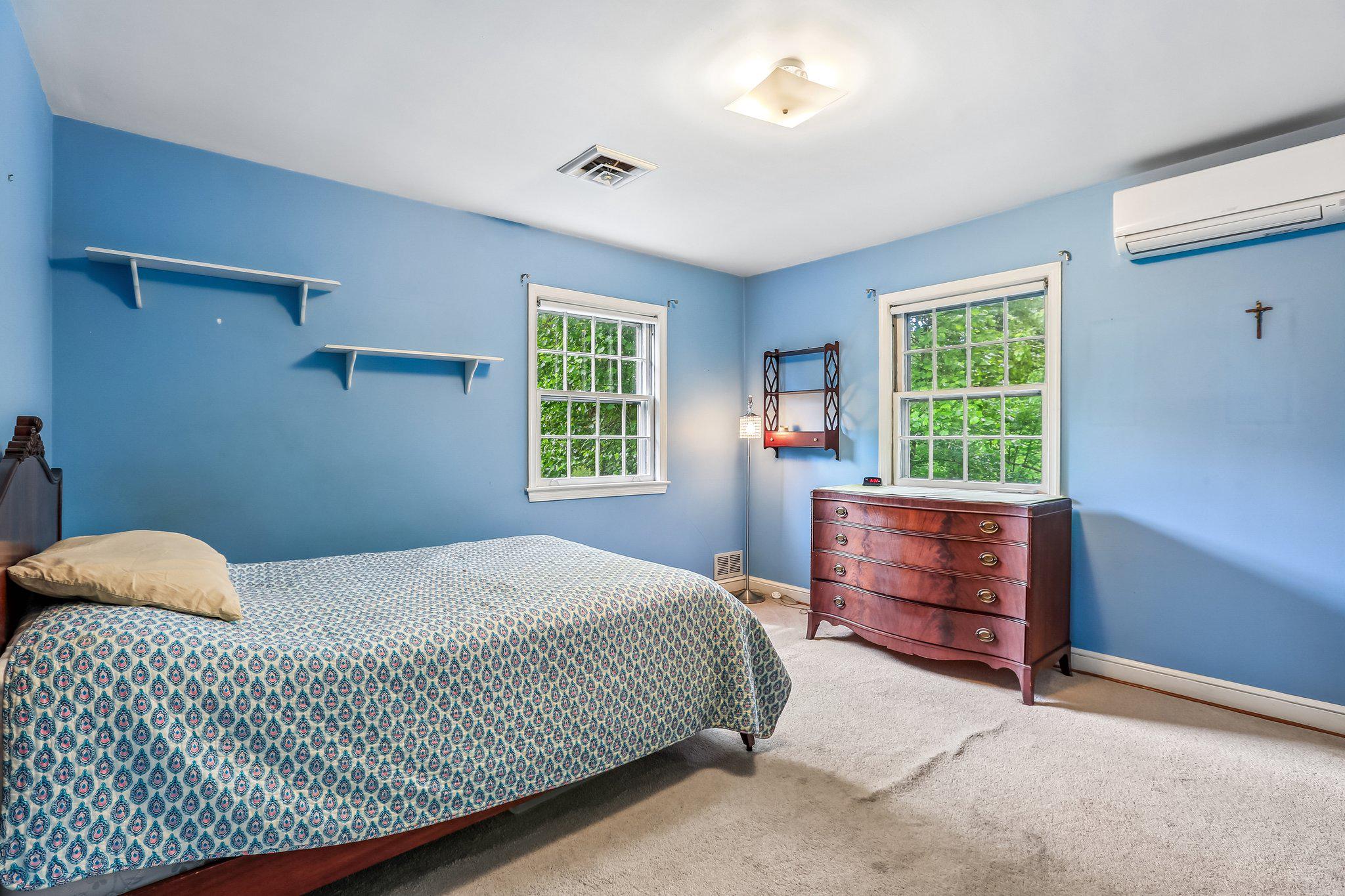 221 Patuxent Road Laurel, MD 20707 - Photo 21 of 33 Serene blue bedroom with natural light.