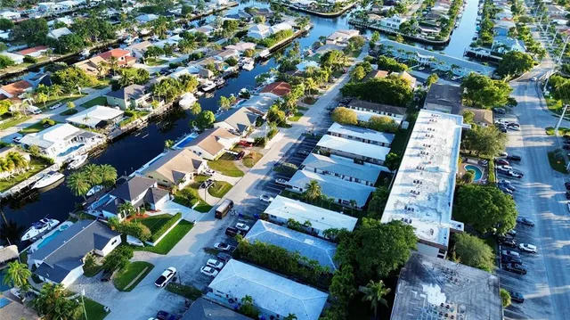 an aerial view of a house with a yard and outdoor seating