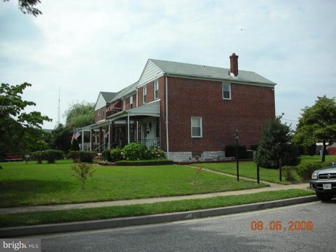 3443 Dunran Road Dundalk, MD 21222 - Photo 1 of 29 a front view of a house with a yard