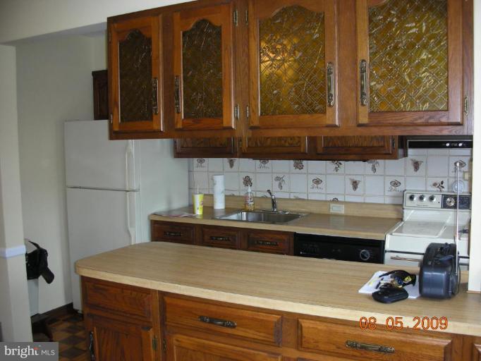 3443 Dunran Road Dundalk, MD 21222 - Photo 12 of 29 a kitchen with a sink and cabinets