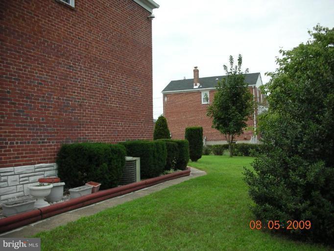 3443 Dunran Road Dundalk, MD 21222 - Photo 18 of 29 a view of a backyard with plants and a garden