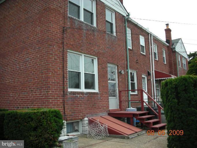 3443 Dunran Road Dundalk, MD 21222 - Photo 21 of 29 a front view of a house with garden