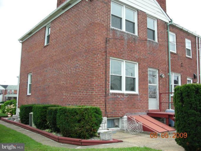 3443 Dunran Road Dundalk, MD 21222 - Photo 22 of 29 a front view of a house with garden