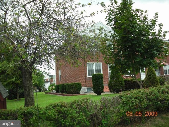 3443 Dunran Road Dundalk, MD 21222 - Photo 23 of 29 a front view of a house with a yard