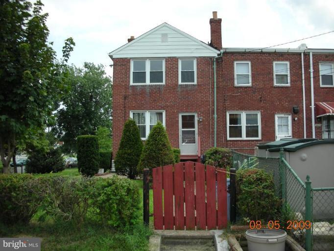 3443 Dunran Road Dundalk, MD 21222 - Photo 24 of 29 a front view of a house with a garden