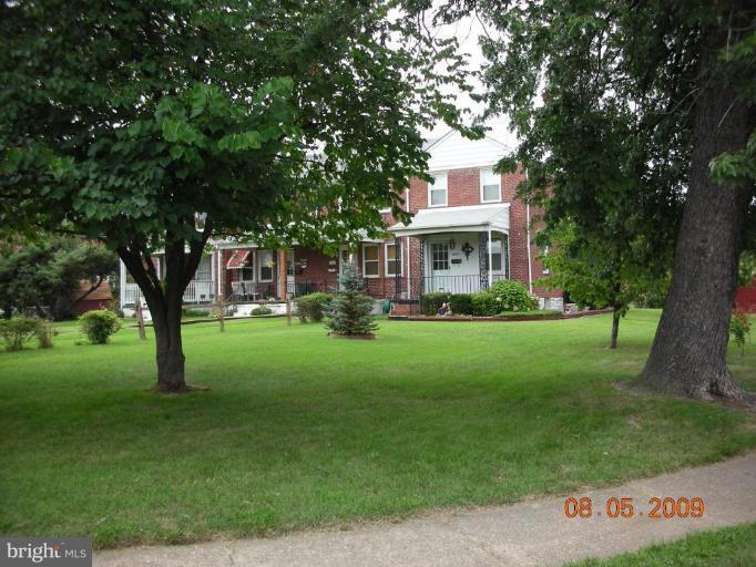 3443 Dunran Road Dundalk, MD 21222 - Photo 27 of 29 a front view of a house with a garden