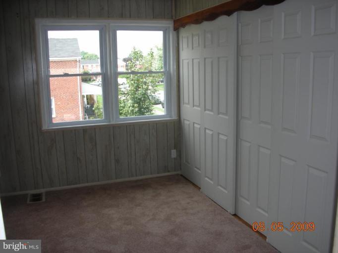 3443 Dunran Road Dundalk, MD 21222 - Photo 6 of 29 a view of an empty room with a window