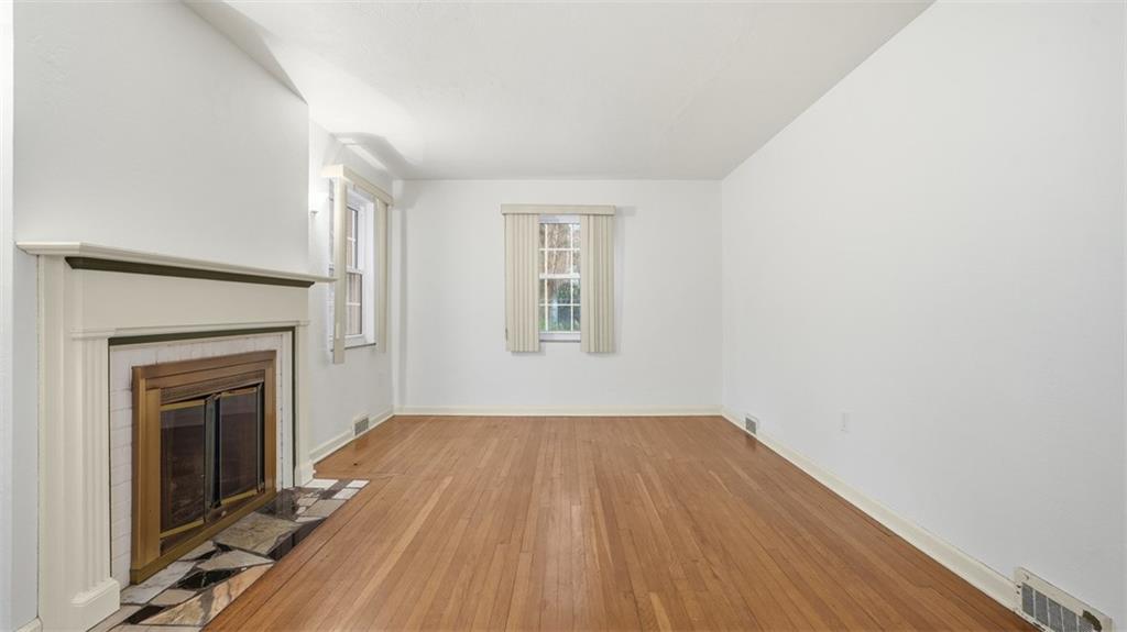 2339 Collins Road Pittsburgh, PA 15235 - Photo 12 of 24 a view of empty room with wooden floor and fireplace