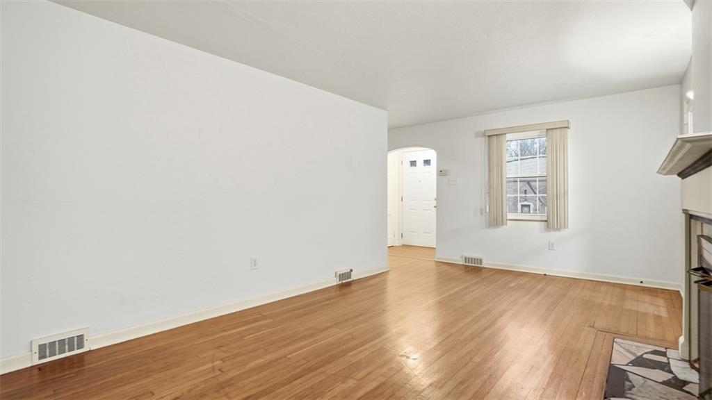 2339 Collins Road Pittsburgh, PA 15235 - Photo 13 of 24 an empty room with wooden floor and windows