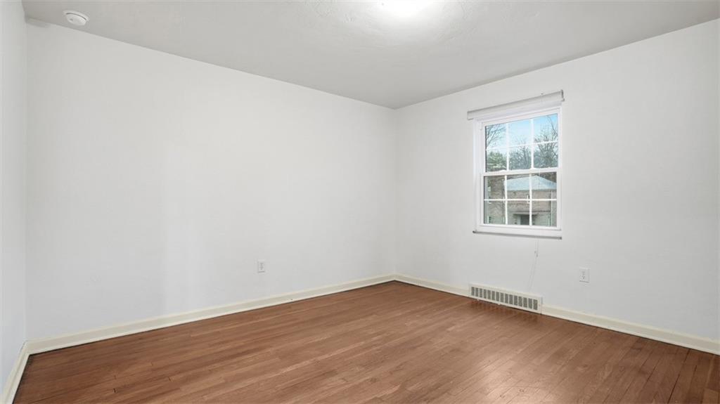 2339 Collins Road Pittsburgh, PA 15235 - Photo 15 of 24 an empty room with wooden floor and windows