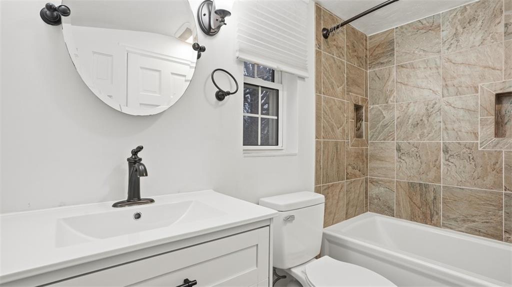 2339 Collins Road Pittsburgh, PA 15235 - Photo 17 of 24 a bathroom with a sink a toilet and shower