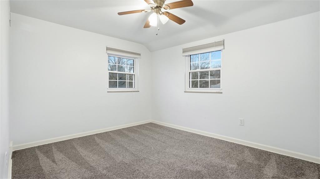 2339 Collins Road Pittsburgh, PA 15235 - Photo 20 of 24 an empty room with a window and a fan