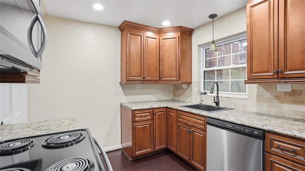 2339 Collins Road Pittsburgh, PA 15235 - Photo 6 of 24 a kitchen with stainless steel appliances granite countertop a sink stove and cabinets