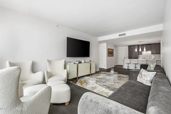 a bedroom with a large bed and a large window