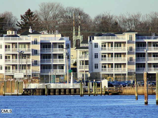 36 Shipyard Lane, Unit B Milford, CT 06460 - Photo 1 of 1 a front view of a building with blue garden