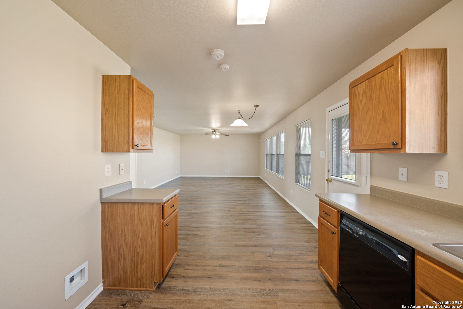 144 Crest Bluff Cibolo, TX 78108 - Photo 12 of 30 a hallway with wooden floor and a sink