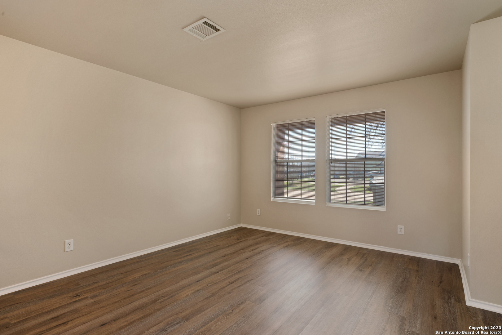 144 Crest Bluff Cibolo, TX 78108 - Photo 15 of 30 an empty room with wooden floor and windows
