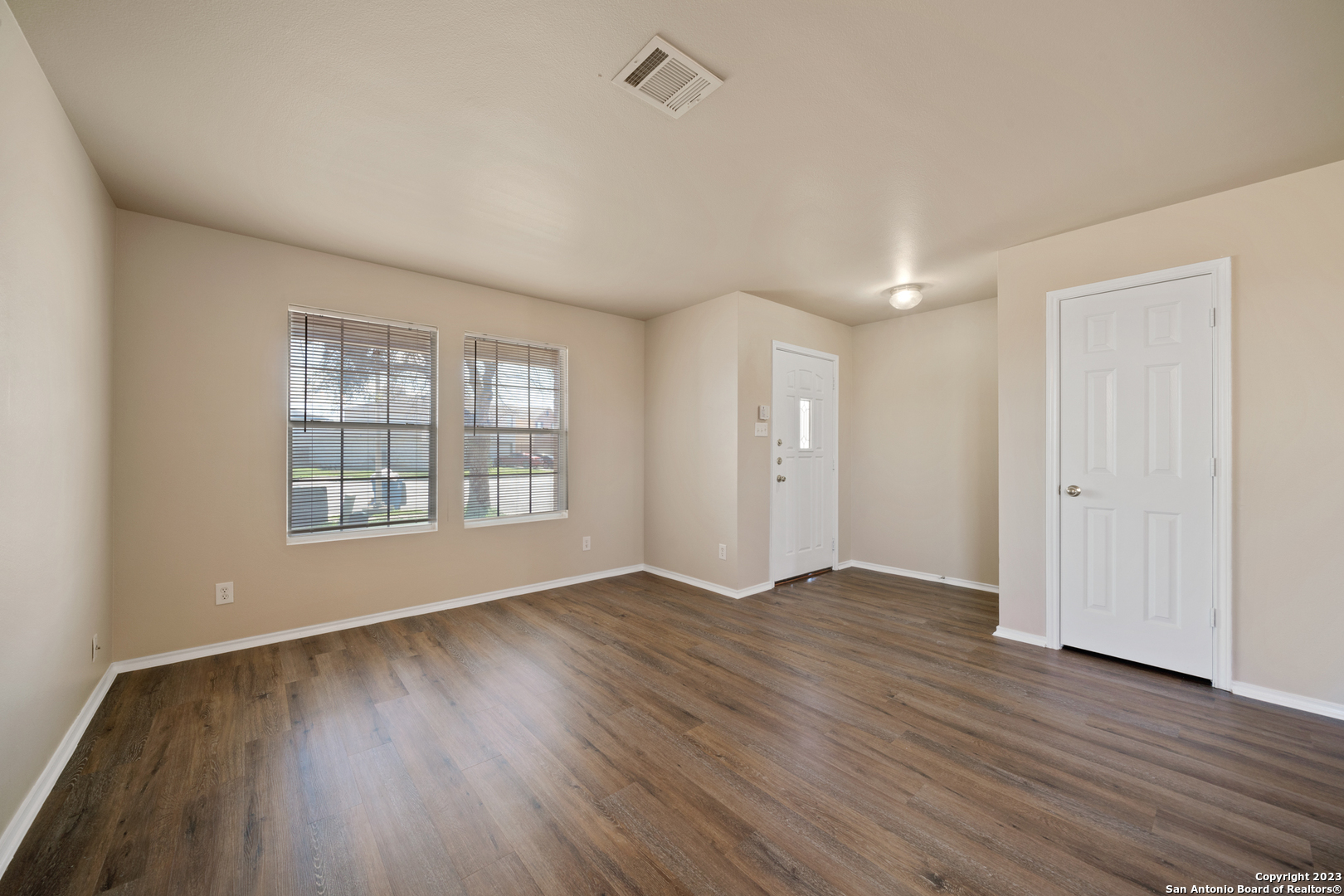 144 Crest Bluff Cibolo, TX 78108 - Photo 16 of 30 a view of an empty room with wooden floor and a window