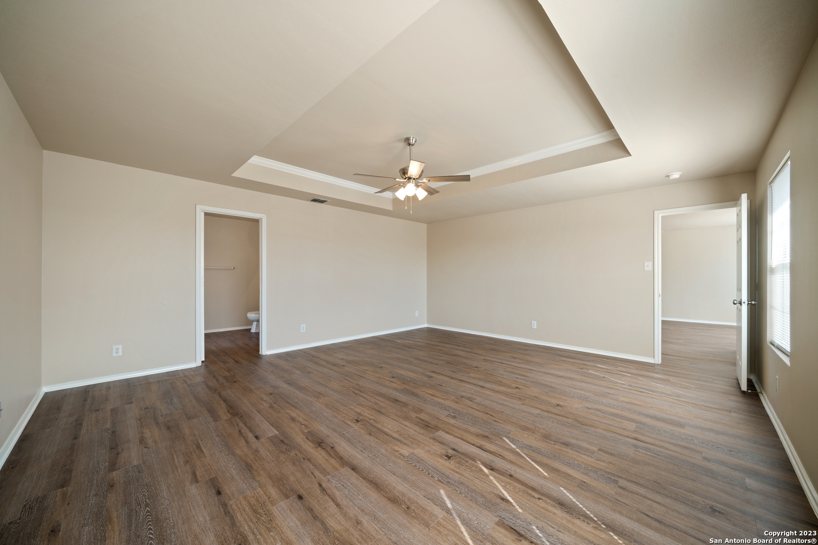 144 Crest Bluff Cibolo, TX 78108 - Photo 20 of 30 a view of an empty room with wooden floor