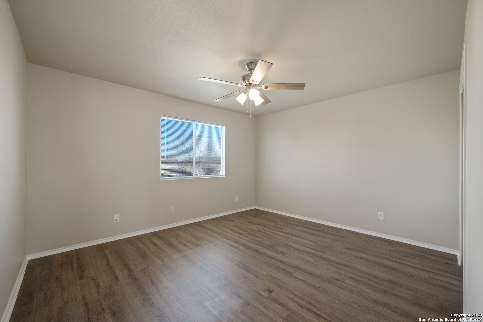 144 Crest Bluff Cibolo, TX 78108 - Photo 23 of 30 a view of a room with wooden floor and a ceiling fan