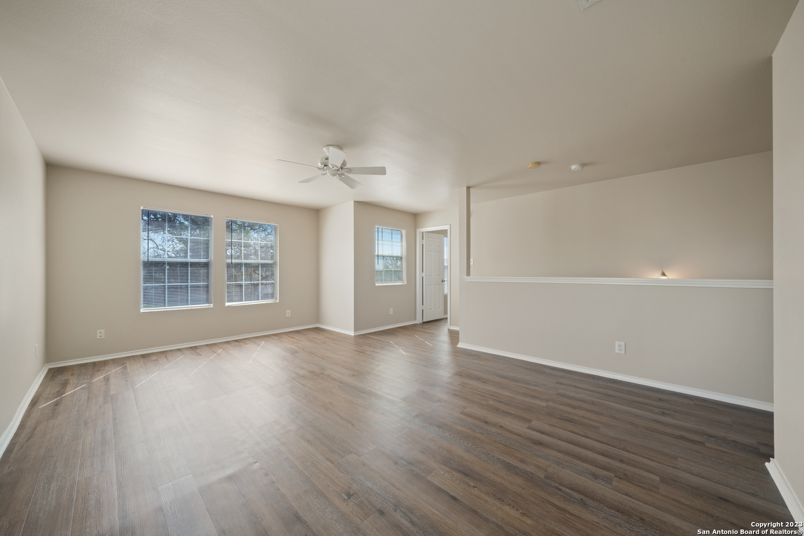 144 Crest Bluff Cibolo, TX 78108 - Photo 27 of 30 a view of an empty room with wooden floor and a window