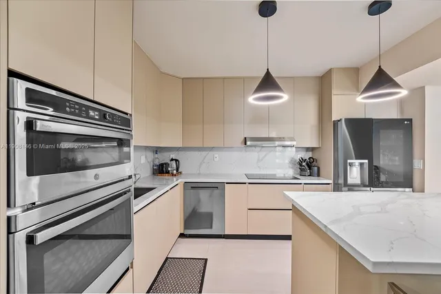 a kitchen with a sink a stove and cabinets