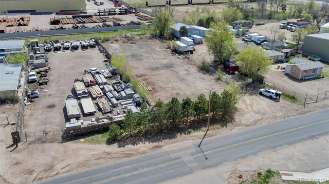 an aerial view of a house with a yard and garden