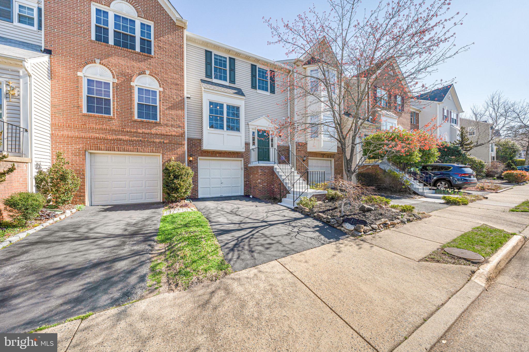 6911 Kerrywood Circle Centreville, VA 20121 - Photo 1 of 44 a front view of a multi story residential apartment building