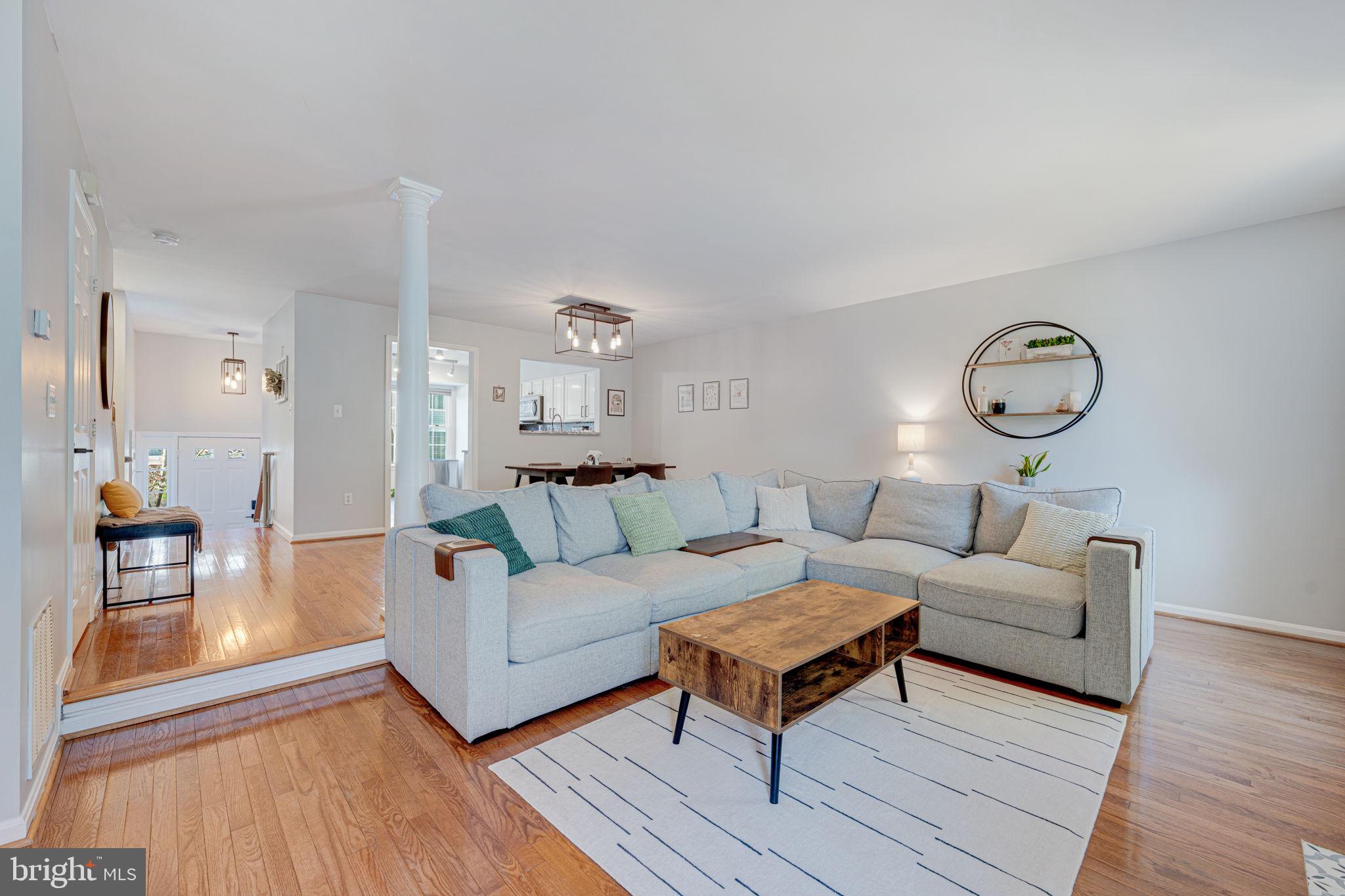 6911 Kerrywood Circle Centreville, VA 20121 - Photo 13 of 44 a living room with furniture and wooden floor