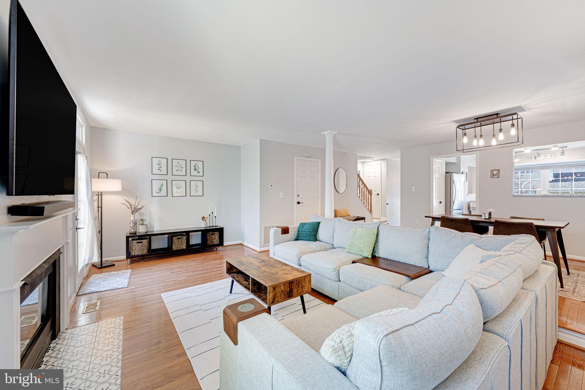 6911 Kerrywood Circle Centreville, VA 20121 - Photo 14 of 44 a living room with furniture and a flat screen tv