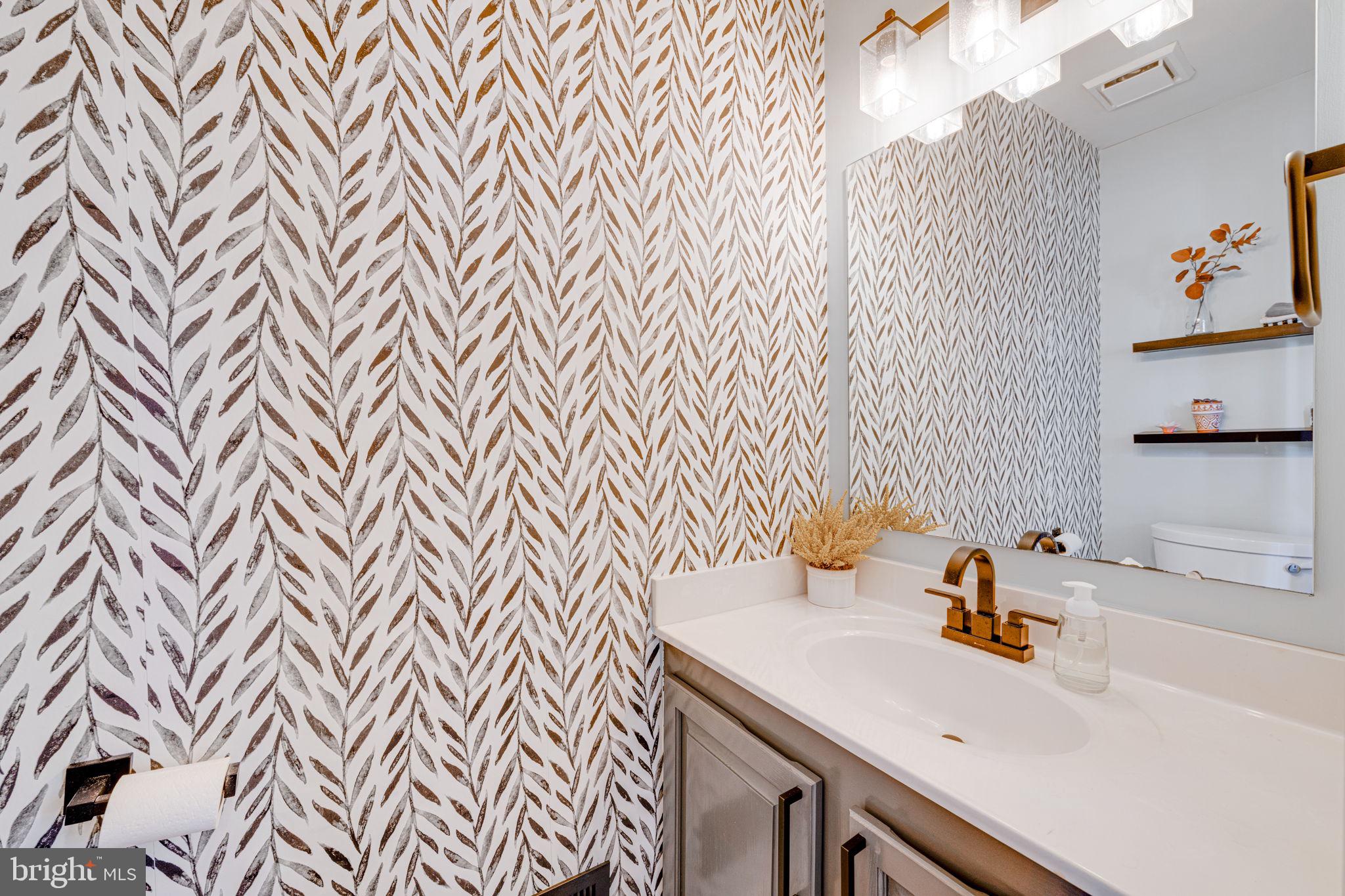 6911 Kerrywood Circle Centreville, VA 20121 - Photo 15 of 44 a bathroom with a sink and a mirror