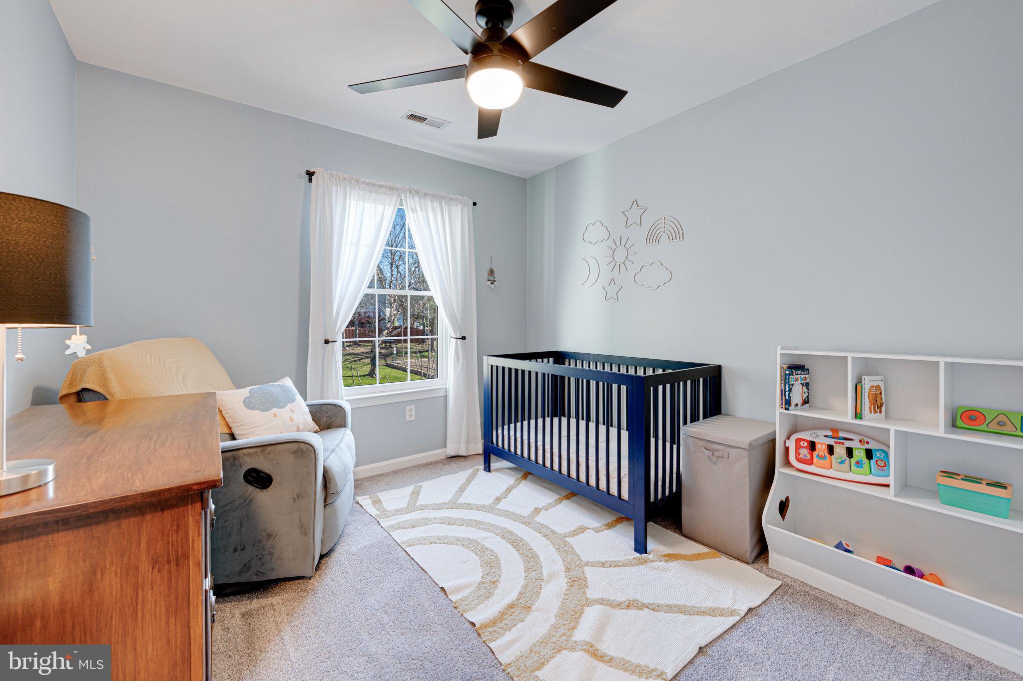 6911 Kerrywood Circle Centreville, VA 20121 - Photo 17 of 44 a bedroom with furniture and a window