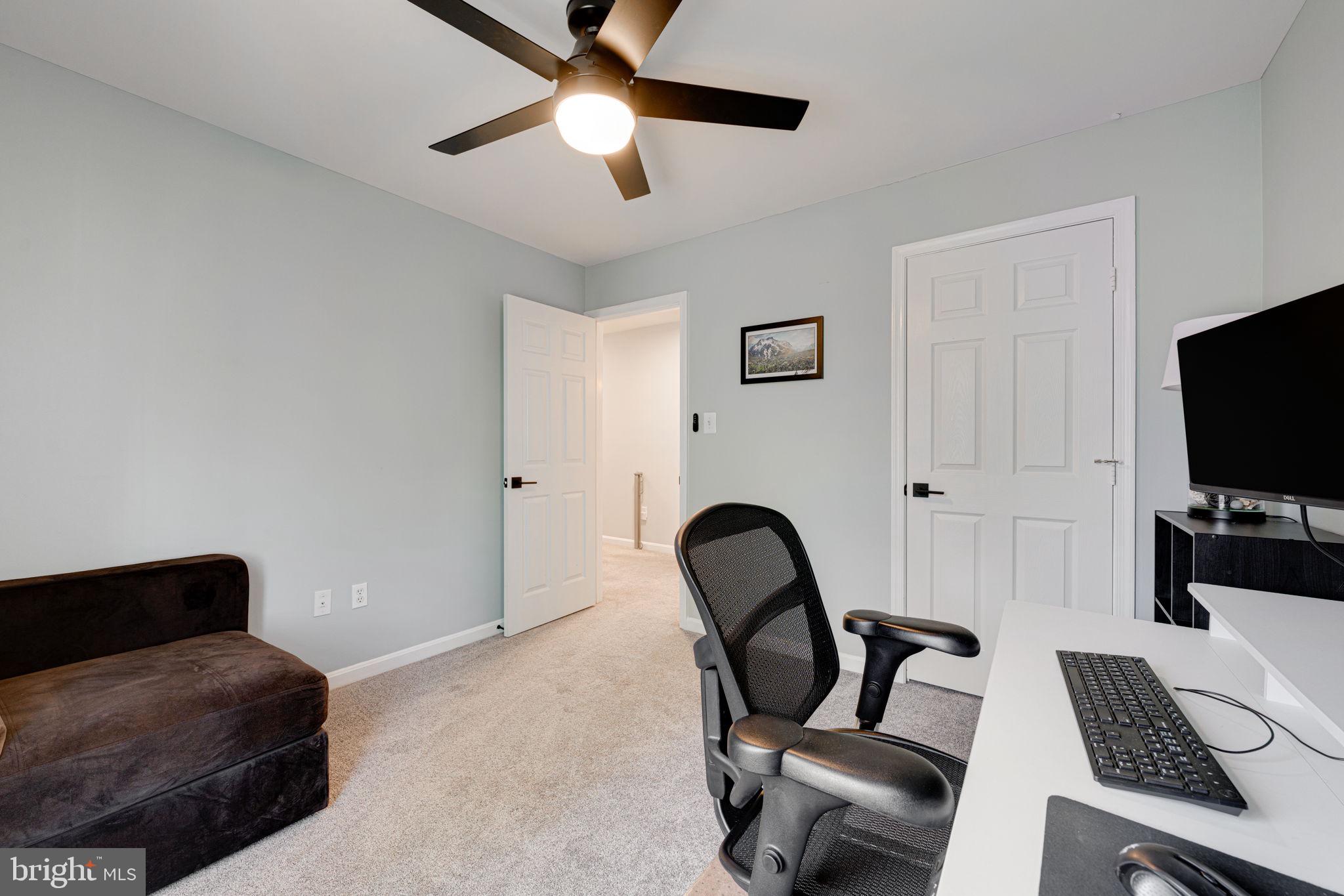 6911 Kerrywood Circle Centreville, VA 20121 - Photo 20 of 44 a work room with furniture and a flat screen tv