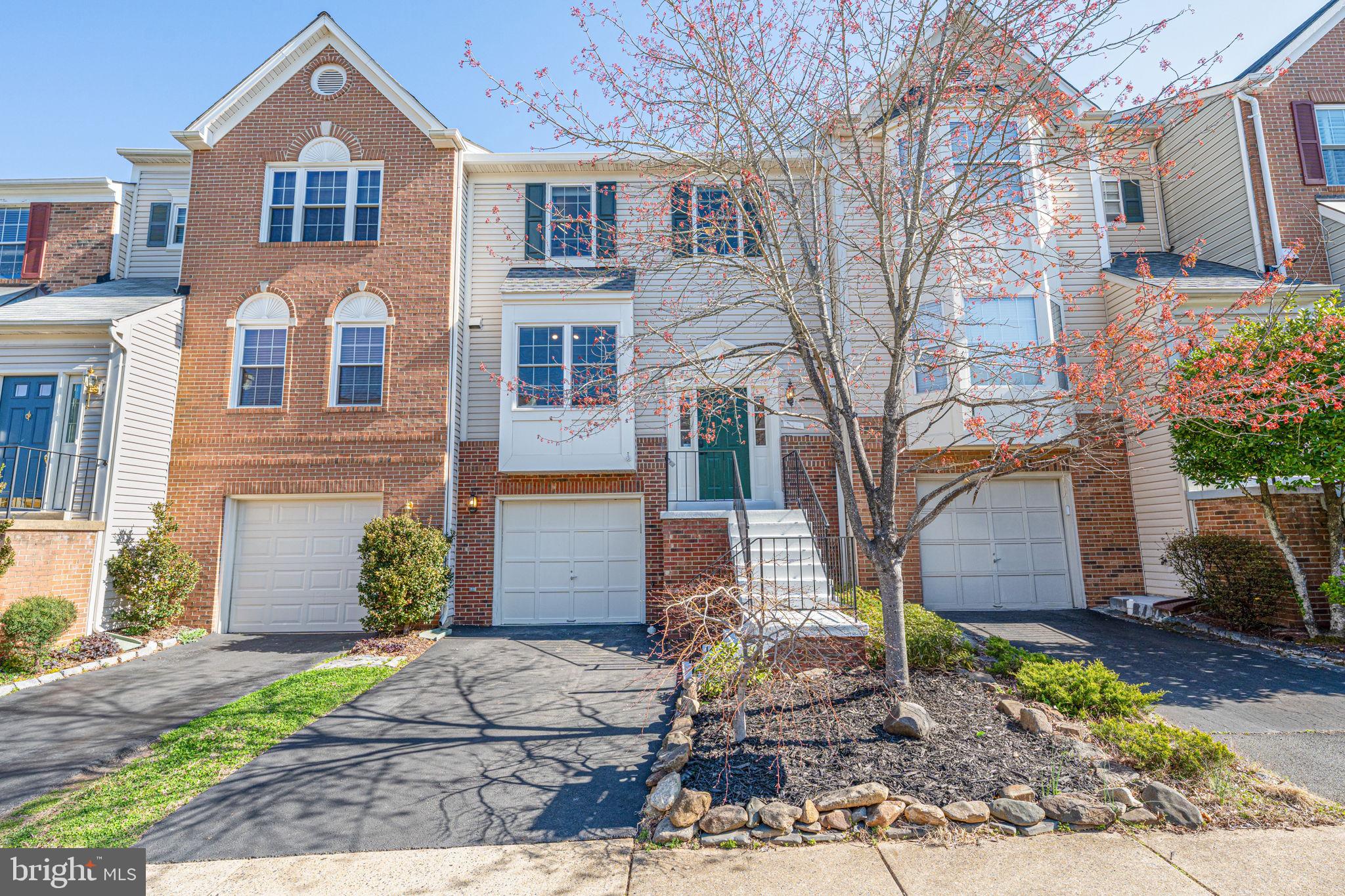 6911 Kerrywood Circle Centreville, VA 20121 - Photo 2 of 44 a front view of a house with garden