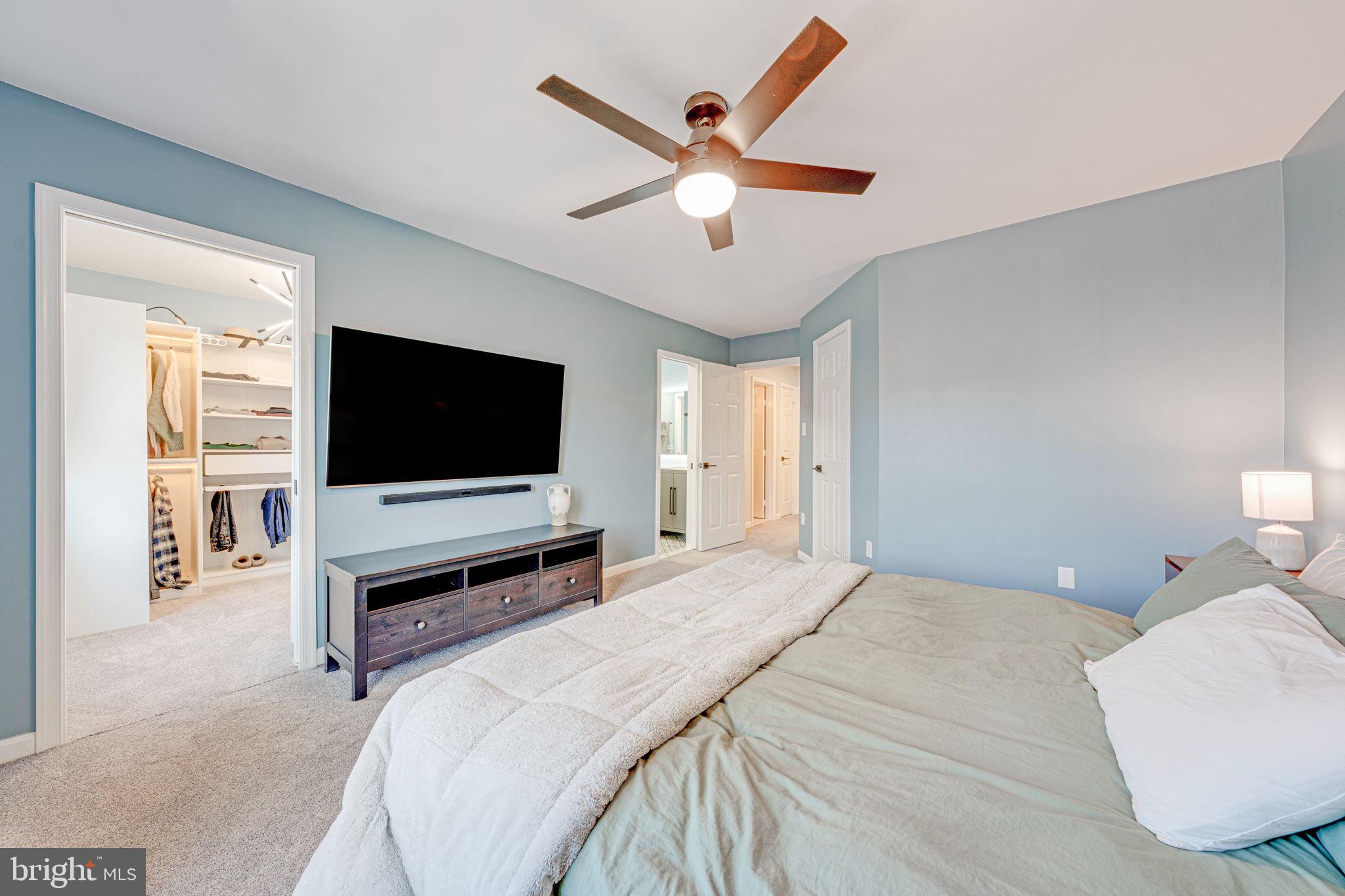 6911 Kerrywood Circle Centreville, VA 20121 - Photo 23 of 44 a bedroom with a bed and a flat screen tv