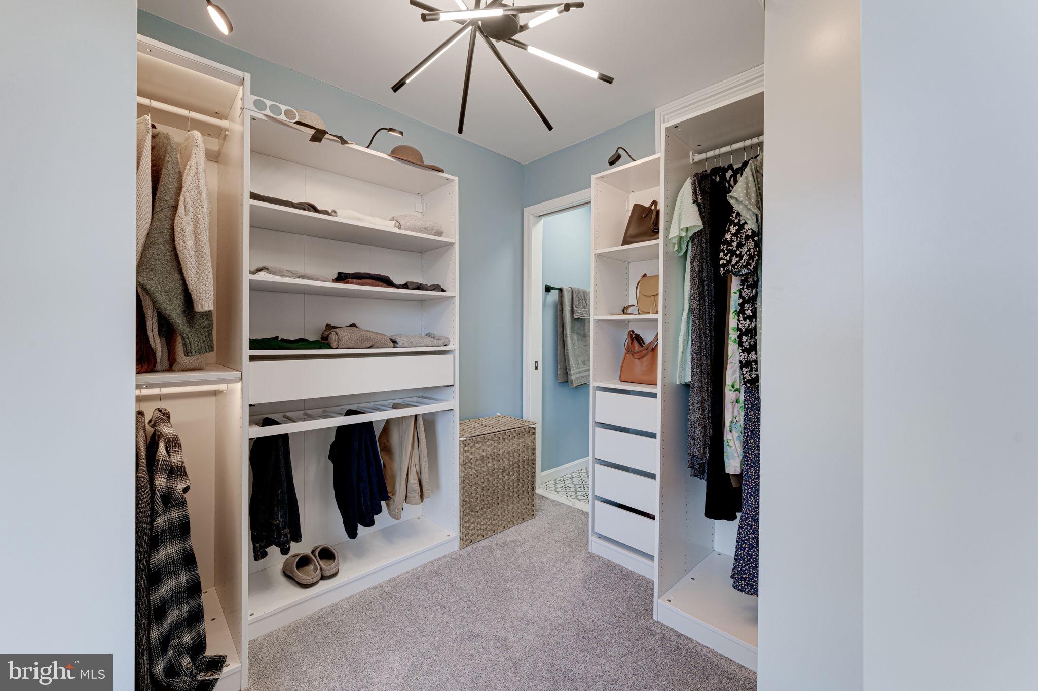 6911 Kerrywood Circle Centreville, VA 20121 - Photo 24 of 44 a view of walk in closet with clothes and shoes