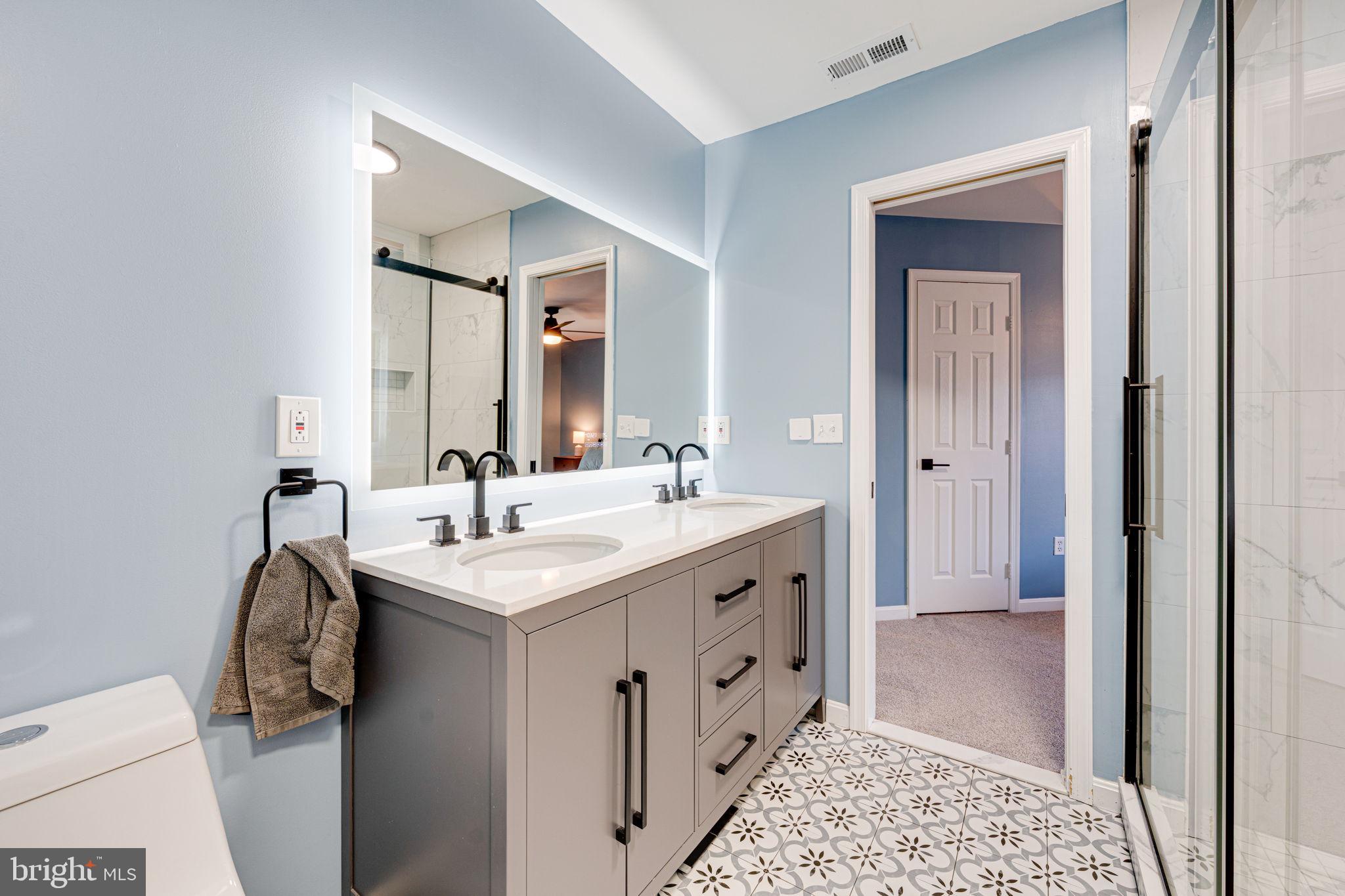 6911 Kerrywood Circle Centreville, VA 20121 - Photo 26 of 44 a bathroom with a sink and a mirror