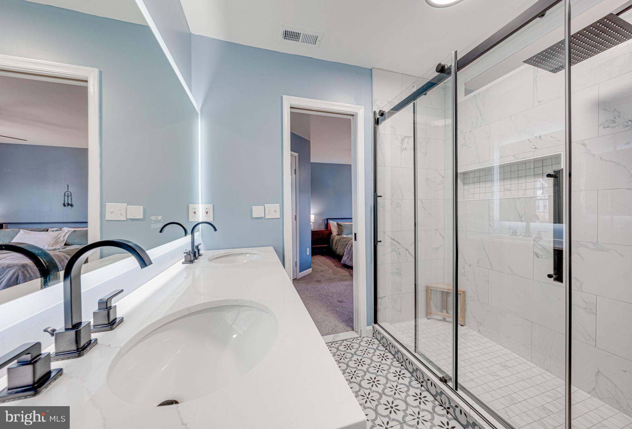 6911 Kerrywood Circle Centreville, VA 20121 - Photo 27 of 44 a en suite bathroom with a sink and a mirror